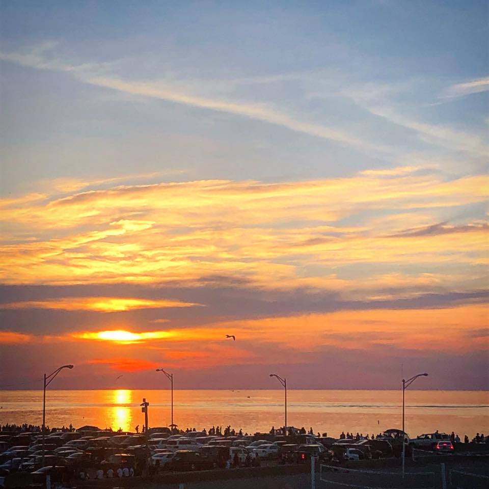 Sun setting over Lake Michigan from rooftop patio